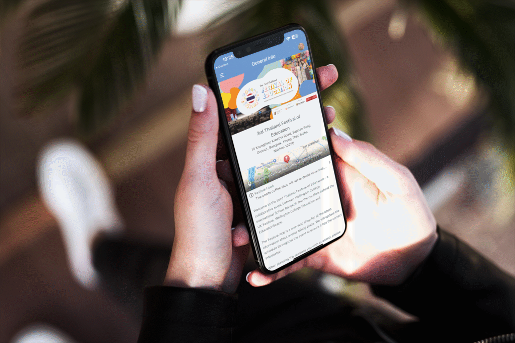 iphone-11-pro-mockup-featuring-a-woman-holding-her-phone-2129-el1 1 - Thailand Festival of Education